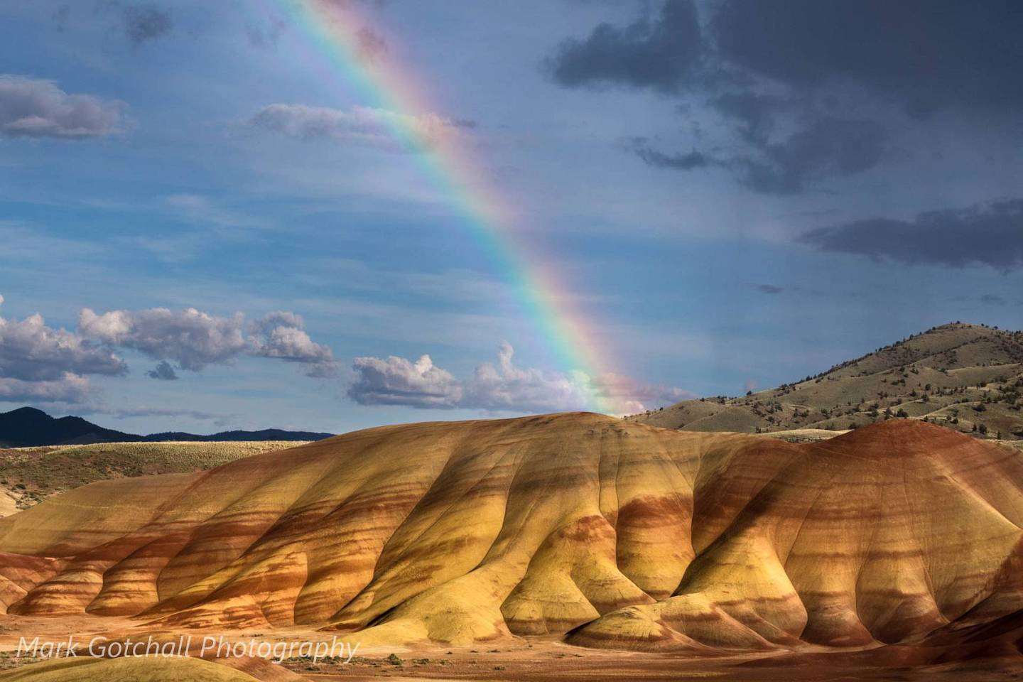Painted Hills Rainbow; a spring rainstorm in late afternoon brings rain add a splash of color over the hills.