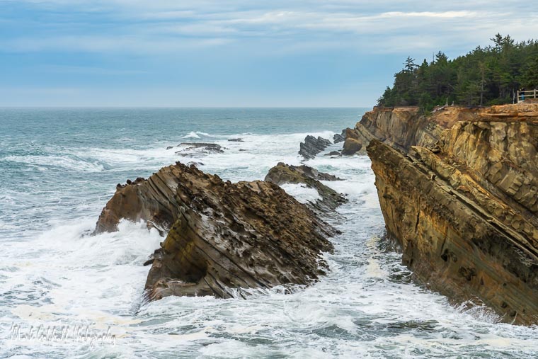 8 foot waves breaking on the rocks at Shore Acres State Park, Oregon