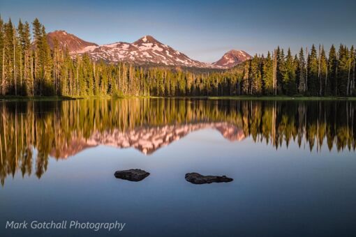 Photograph made at Scott Lake, with the Sisters reflecting in the lake