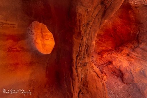 A hole eroded in the sandstone, between two caves, Bowl of Fire, Nevada Photograph of a hole eroded between two caves in Bowl of Fire, Nevada