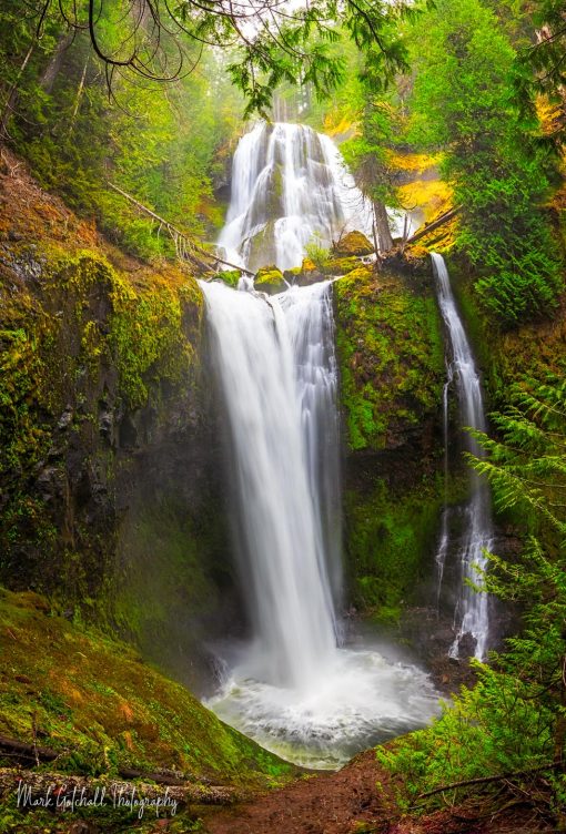 Triple Falls with sunlight glowing mist