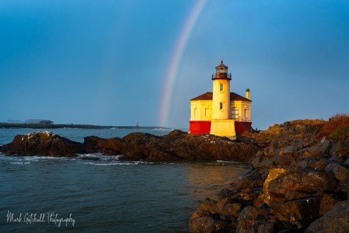 Rainbow over Coquille River Lighthouse Horizontal photo of a rainbow over Coquille River Lighthouse, Bandon, Oregon
