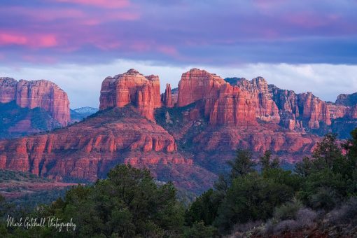 Cathedral Rock Sunset Sunset through the clouds causes the clouds and rocks to glow near Sedona, Arizona