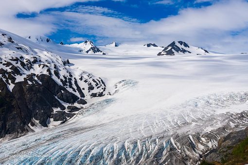 Expansive glacier icefield under blue sky