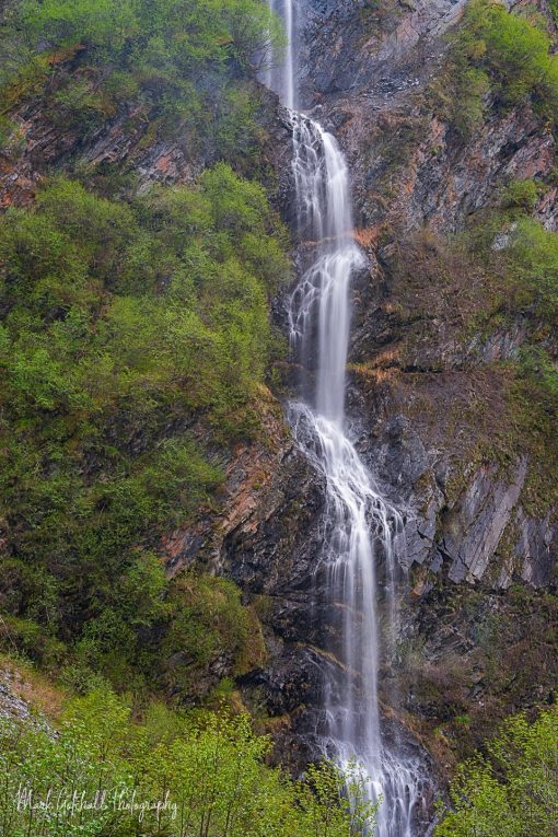 Unnamed Waterfall near Valdez Alaska, cascading down a basalt rock cliff